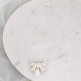 Crystal Bow w/Dangle Pearl Necklace