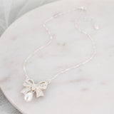Crystal Bow w/Dangle Pearl Necklace