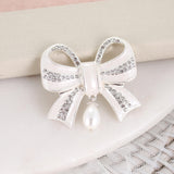 Crystal Bow w/ Dangle Pearl Pendant